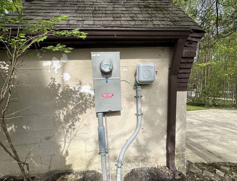 New electric meter and service equipment on a home exterior